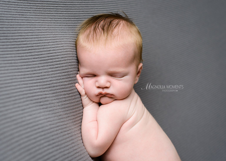 Spring City newborn photography, Newborn boy posed on gray by Magnolia Moments Photography who does newborn photography near me